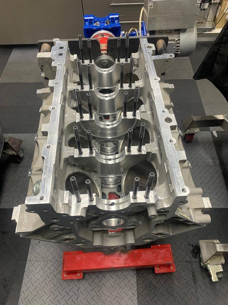 Machined LS block upside down on an engine stand with main stud kit fitted, ready for the 416ci stroker crank