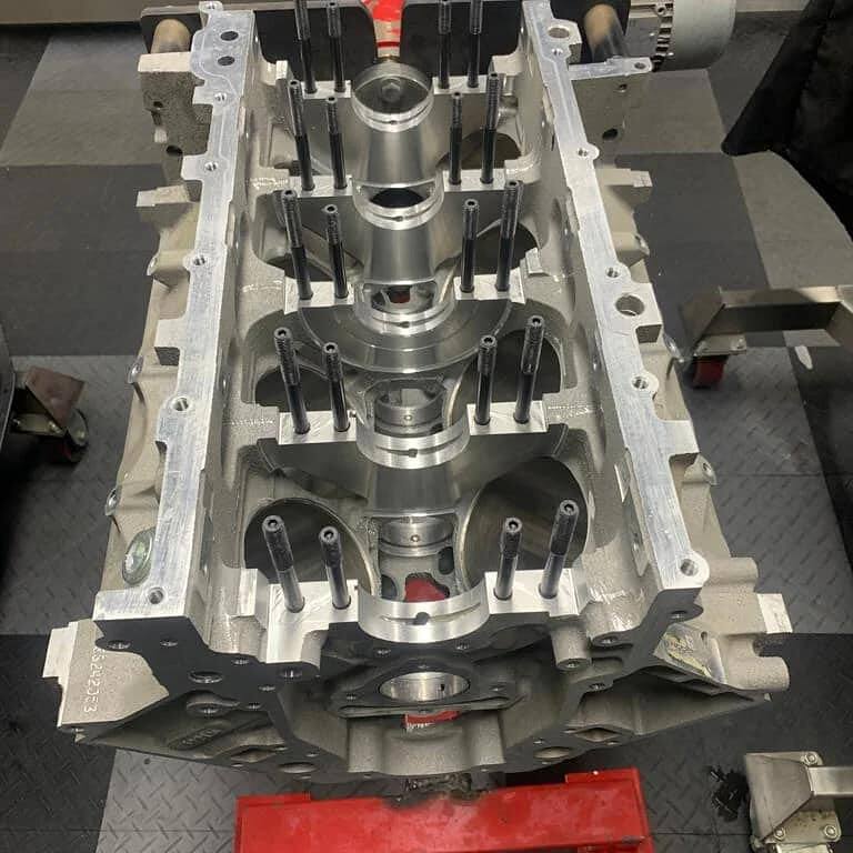 Bare LS block with main bearing studs fitted, prepared for a 416ci stroker build