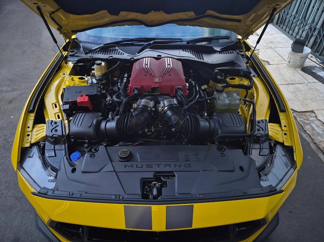 Roush supercharger on the V8 of a yellow Ford S650 Mustang GT