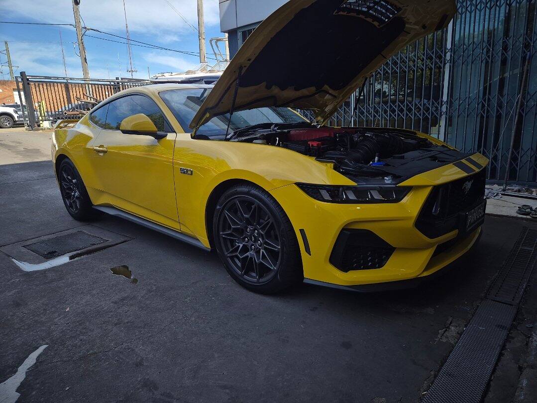 Yellow Ford S650 Mustang GT fitted with a Tickford Roush supercharger kit, making just under 600 hp at the wheels