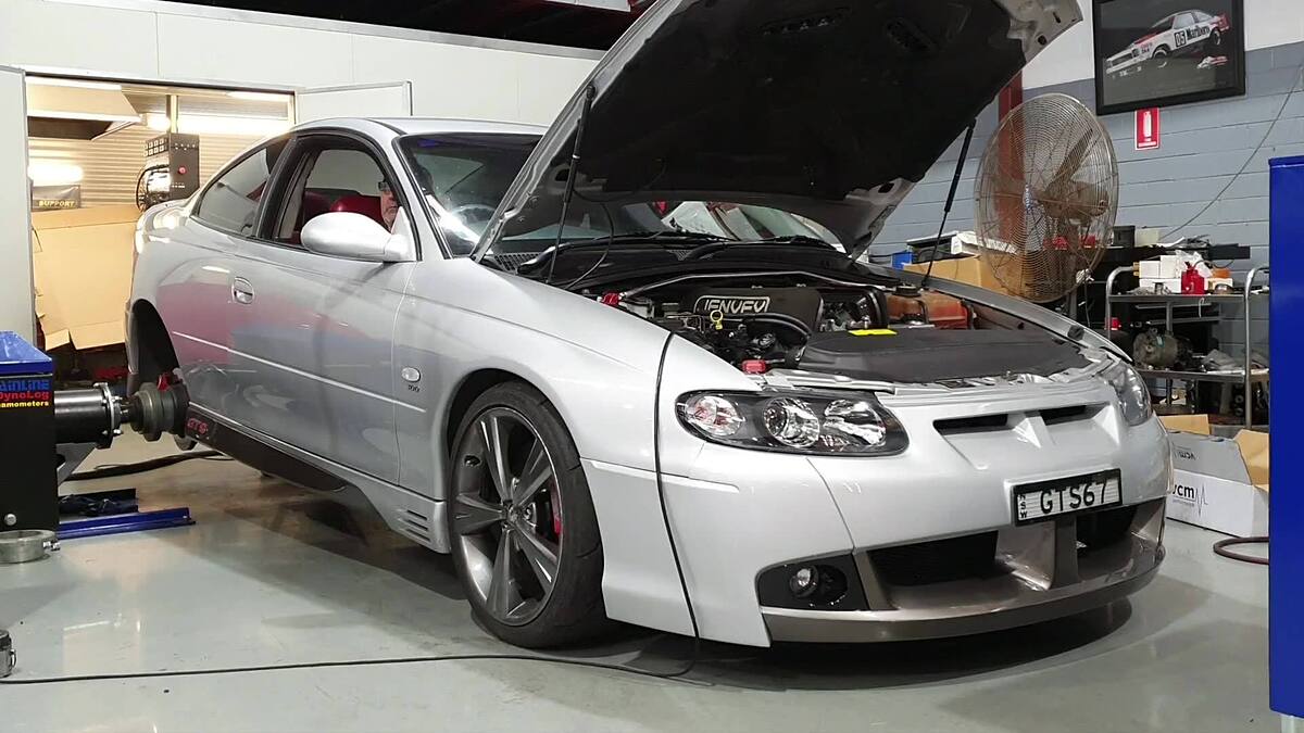 Silver HSV GTS Monaro coupe with a Sam's Performance built 383 on the hub dyno, making 500+ rwhp