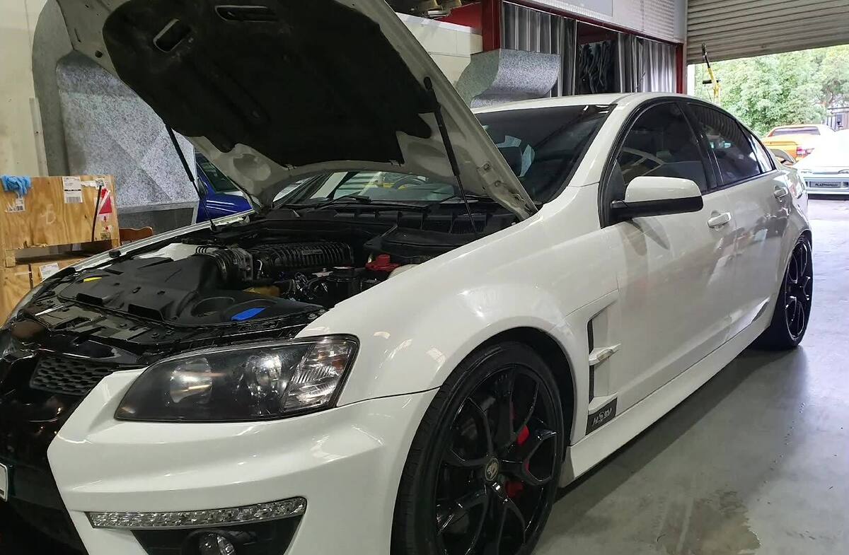White HSV with a Sam's Performance built forged 6.2 bottom end and Harrop 2300 HTV supercharger, bonnet up