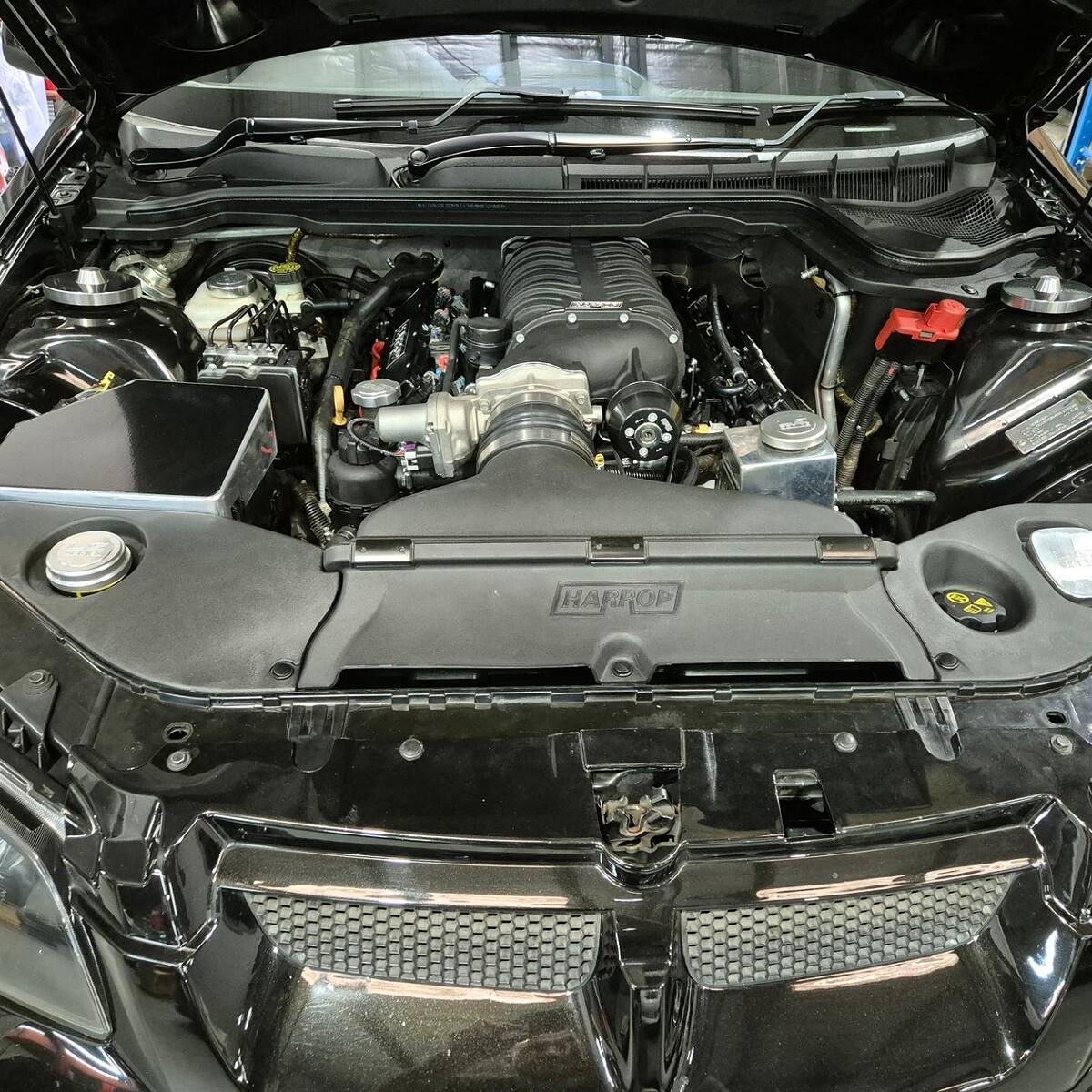 Harrop supercharger on the LS2 of a black HSV VE GTS, making 620+ rwhp