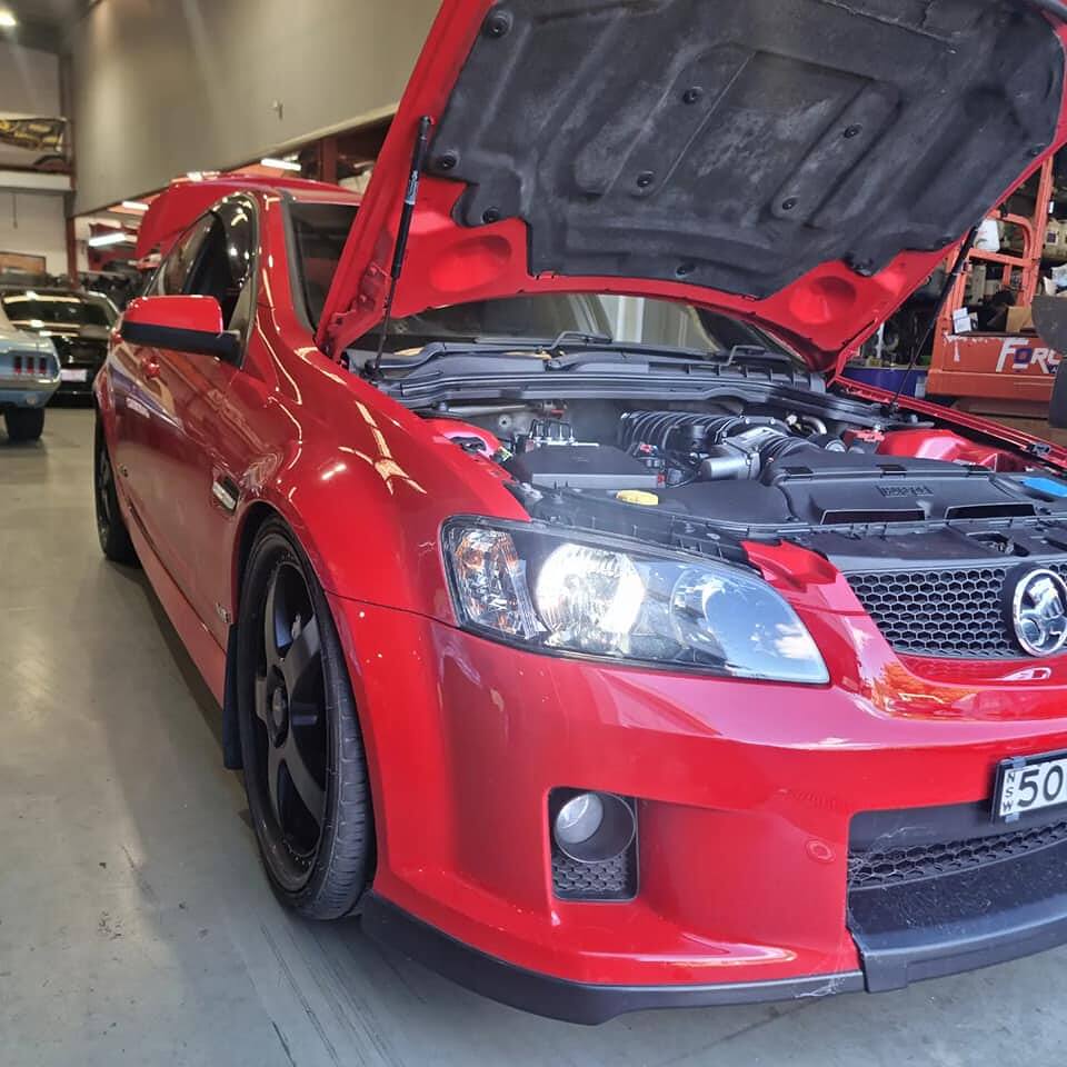 Red Holden VE SS with a Harrop 2300 supercharger added by Sam's Performance, making 620+ rwhp