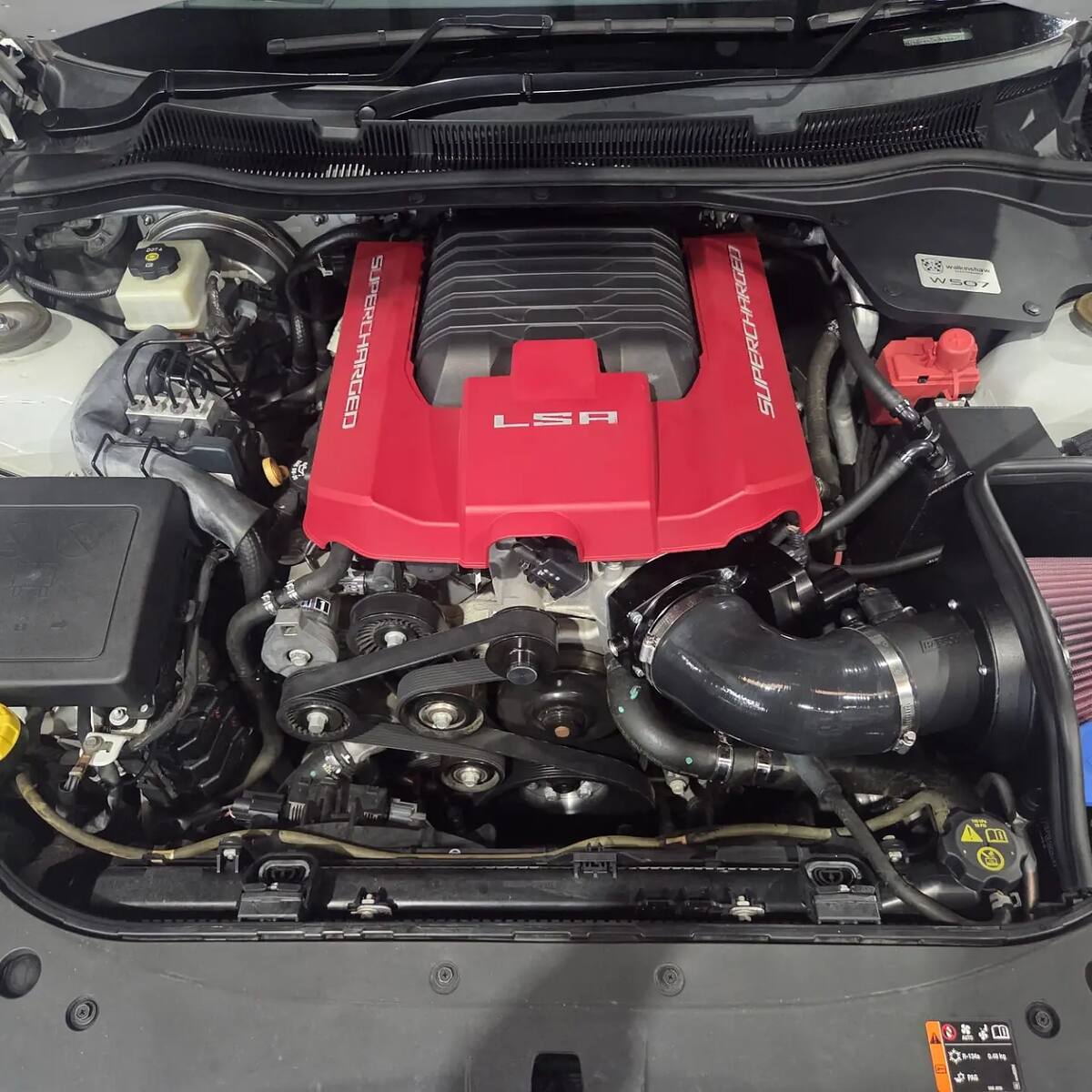 Supercharged LSA with boosted pulleys and cold air intake in a white HSV VF GTS