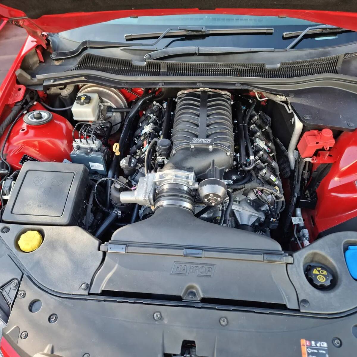 Harrop supercharger on the LS3 in a red HSV VF Maloo