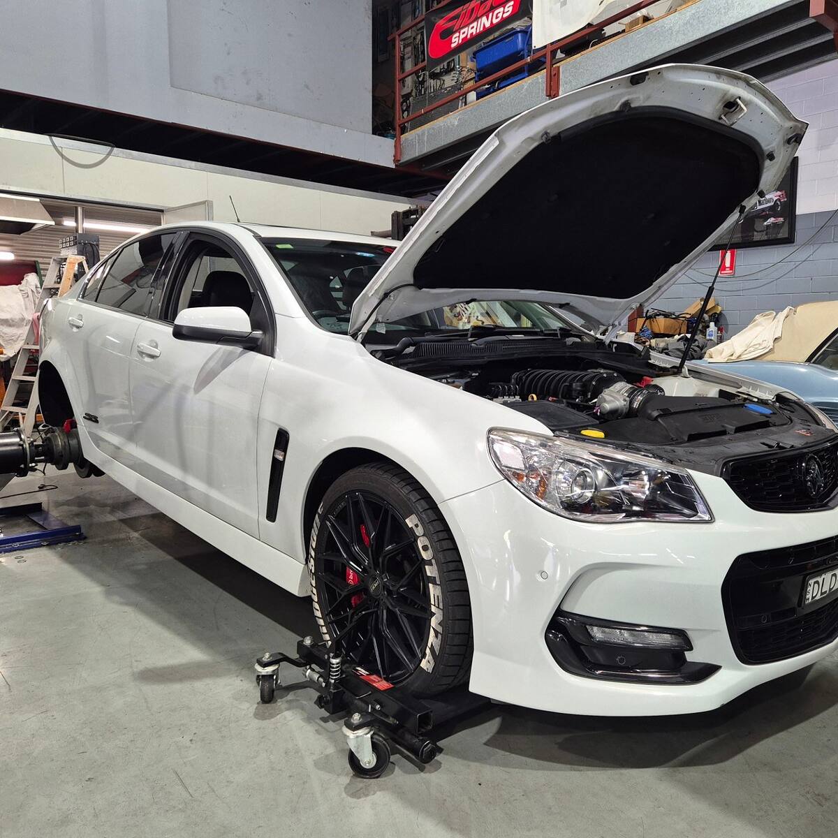 White Holden VF SS with a built 416ci stroker and Harrop 2650 blower on the hub dyno at Sam's Performance